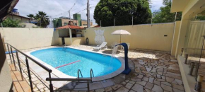 Casa ampla com piscina e churrasqueira em PN